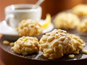 Pignoli Cookies, White Coffee Cups. Panellets