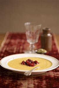 Bowl of Pumpkin Soup with Cranberries