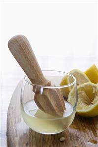 Fresh Lemon Juice with Juicer and Lemons