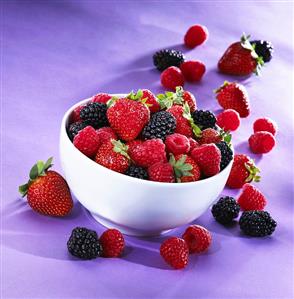 Mixed Fresh Berries In and Beside a Bowl