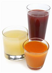 Three Glasses of Assorted Juice; White Background