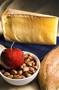 Wedge of Gruyere Cheese; Apple with Hazelnuts; Bread