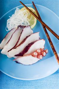 Octopus on a Blue Plate with Chopsticks