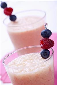 Raspberry Smoothies Garnished with Fresh Raspberries and Blueberries