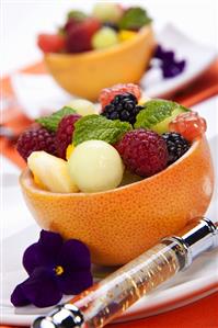 Fresh Fruit Salad in Grapefruit Peel; Pansy Garnish