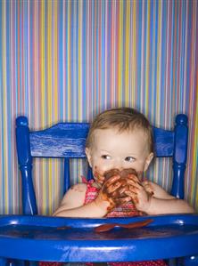 Baby Eating Chocolate Pudding