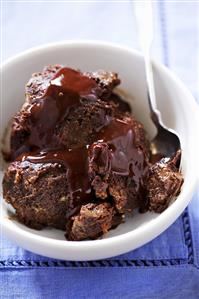 Bowl of Chocolate Bread Pudding with Chocolate Sauce