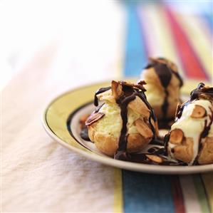 Profiteroles Filled with Anise Ice Cream; Drizzled with Warm Chocolate Sauce