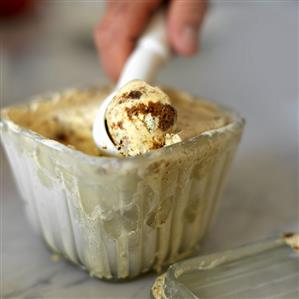 Lemon Speculoos Ice Cream Being Scooped from Container