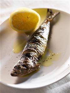 Grilled Sardine on a Plate; Lemon