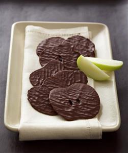 Chocolate Covered Apple Slices with Two Fresh Apple Slices