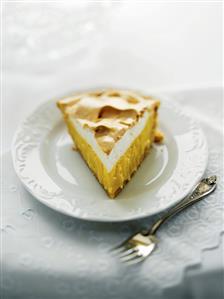 Slice of Lemon Pie on White Plate
