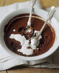 Bowl of Chocolate Mousse with Cream and Two Spoons