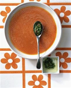 Cold carrot soup with herb and chili salsa