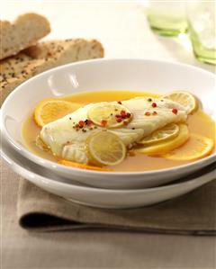 Bacalao al azafran en caldo de citricos. Receta disponible TR. Cod Fish in Safron with Citric Light Soup.