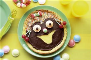 Cara feliz de chocolate y caramelos. Receta disponible. 
Happy Face with Chocolate and Candy
