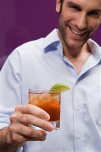 Man drinking a cocktail