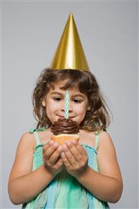 Girl with birthday cupcake