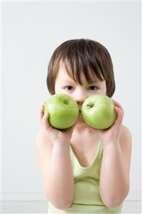 Boy with two apples