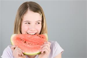 Girl with slice of watermelon