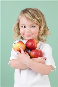 Girl holding apples