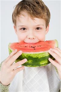 Boy eating watermelon