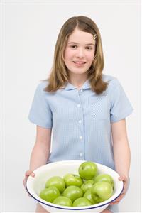 Girl with bowl of apples