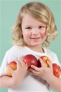 Girl holding apples