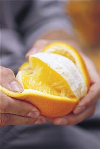 Peeling an orange