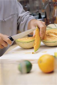 Cutting a melon