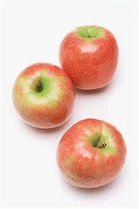 Three pink lady apples