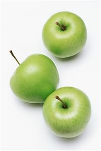 Three golden delicious apples