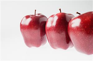 Three red apples