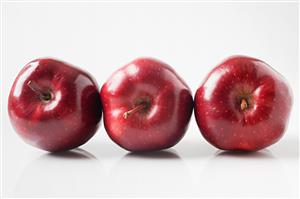 Three red apples