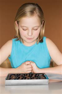 Girl choosing a chocolate