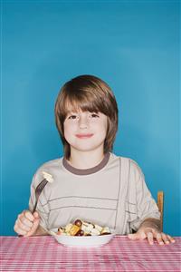 Boy with fruit salad