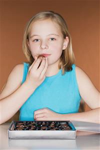 Girl eating a chocolate