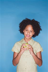 Girl looking holding an apple